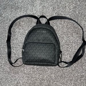 Michael Kors mini backpack purse.